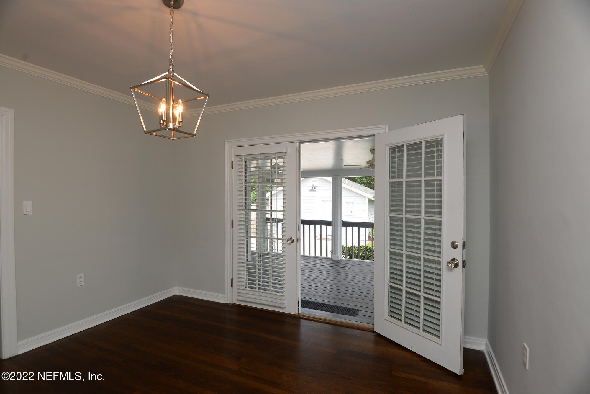 3973 Gadsden Road Jacksonville, FL 32207 - Photo 15 of 45 an empty room with wooden floor and windows