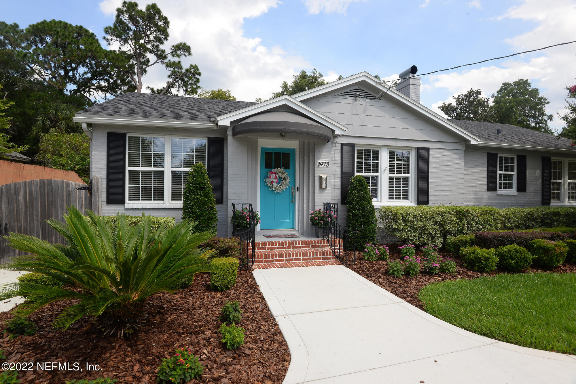 3973 Gadsden Road Jacksonville, FL 32207 - Photo 2 of 45 a front view of a house with a garden