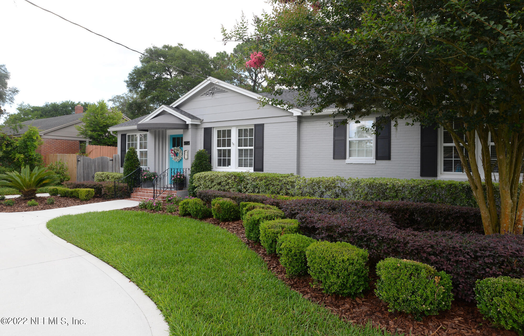 3973 Gadsden Road Jacksonville, FL 32207 - Photo 3 of 45 a front view of a house with garden