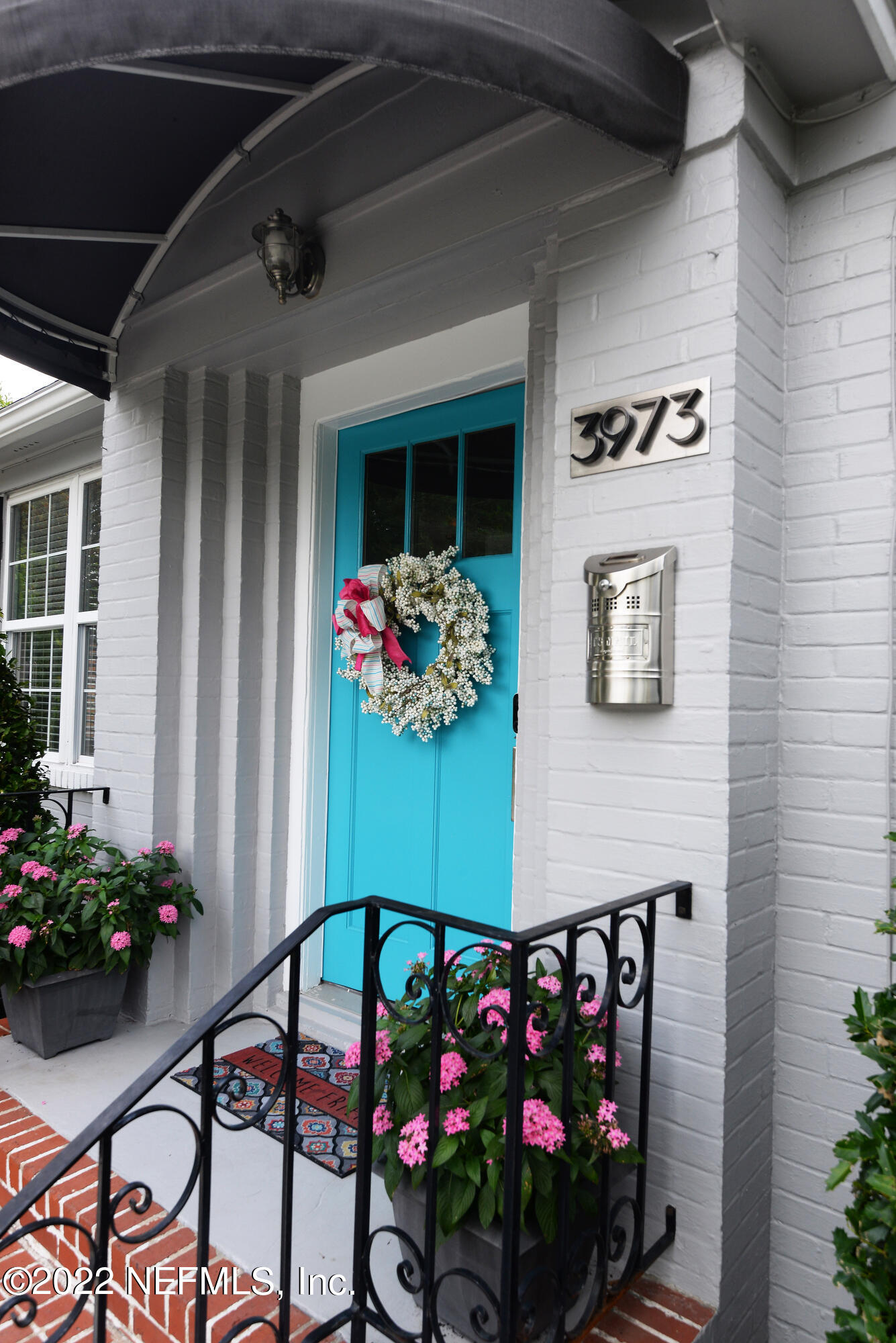 3973 Gadsden Road Jacksonville, FL 32207 - Photo 4 of 45 a front view of a house with flowers