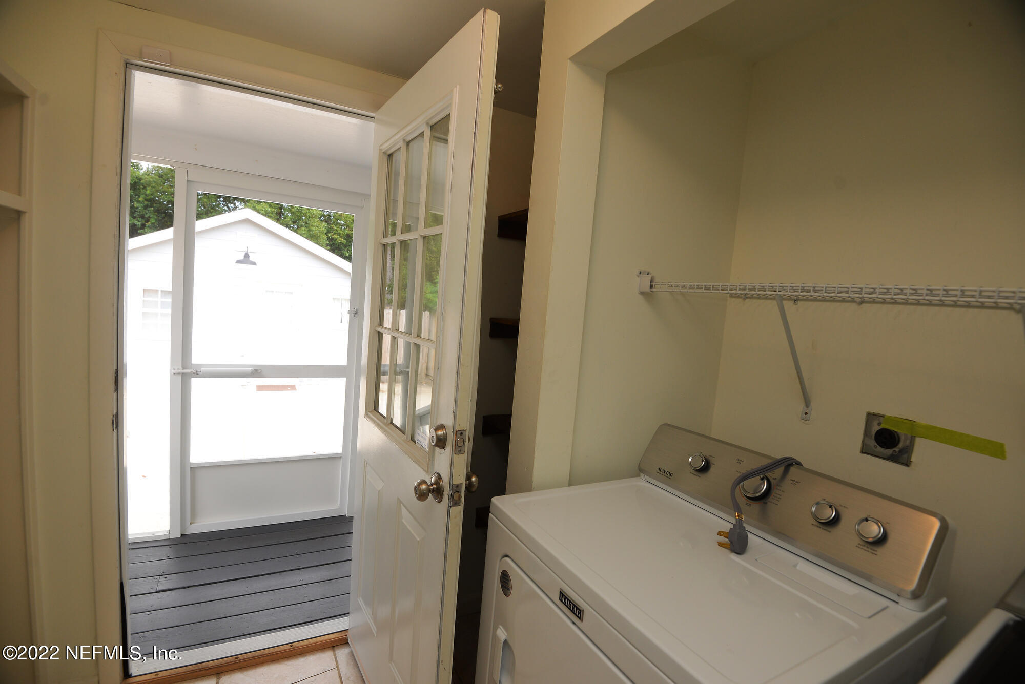 3973 Gadsden Road Jacksonville, FL 32207 - Photo 43 of 45 a bathroom with a sink and a mirror
