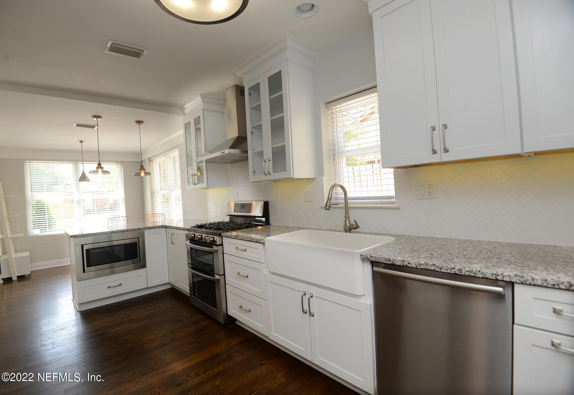 3973 Gadsden Road Jacksonville, FL 32207 - Photo 8 of 45 a kitchen with a sink stove top oven and refrigerator