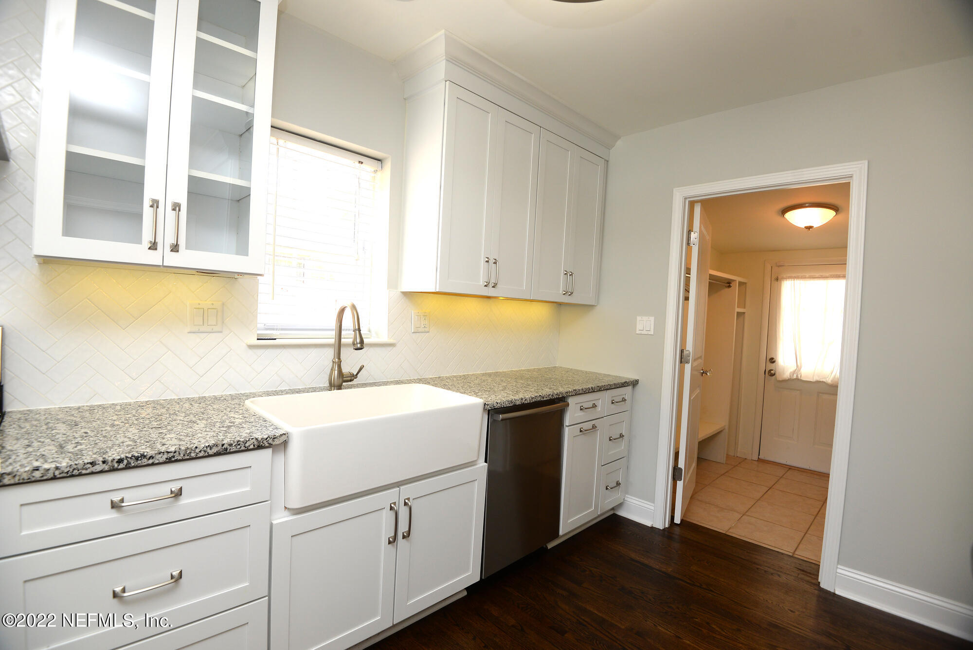 3973 Gadsden Road Jacksonville, FL 32207 - Photo 9 of 45 a utility room with granite countertop cabinets washer and dryer