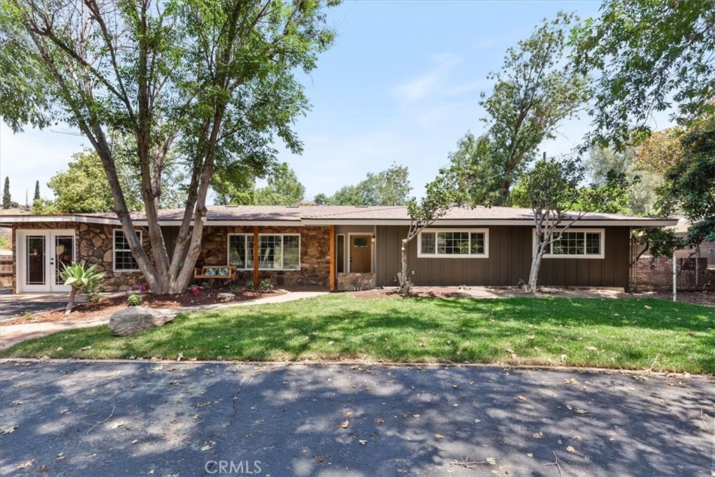 7436 Reche Canyon Road Colton, CA 92324 - Photo 1 of 1 a front view of a house with garden