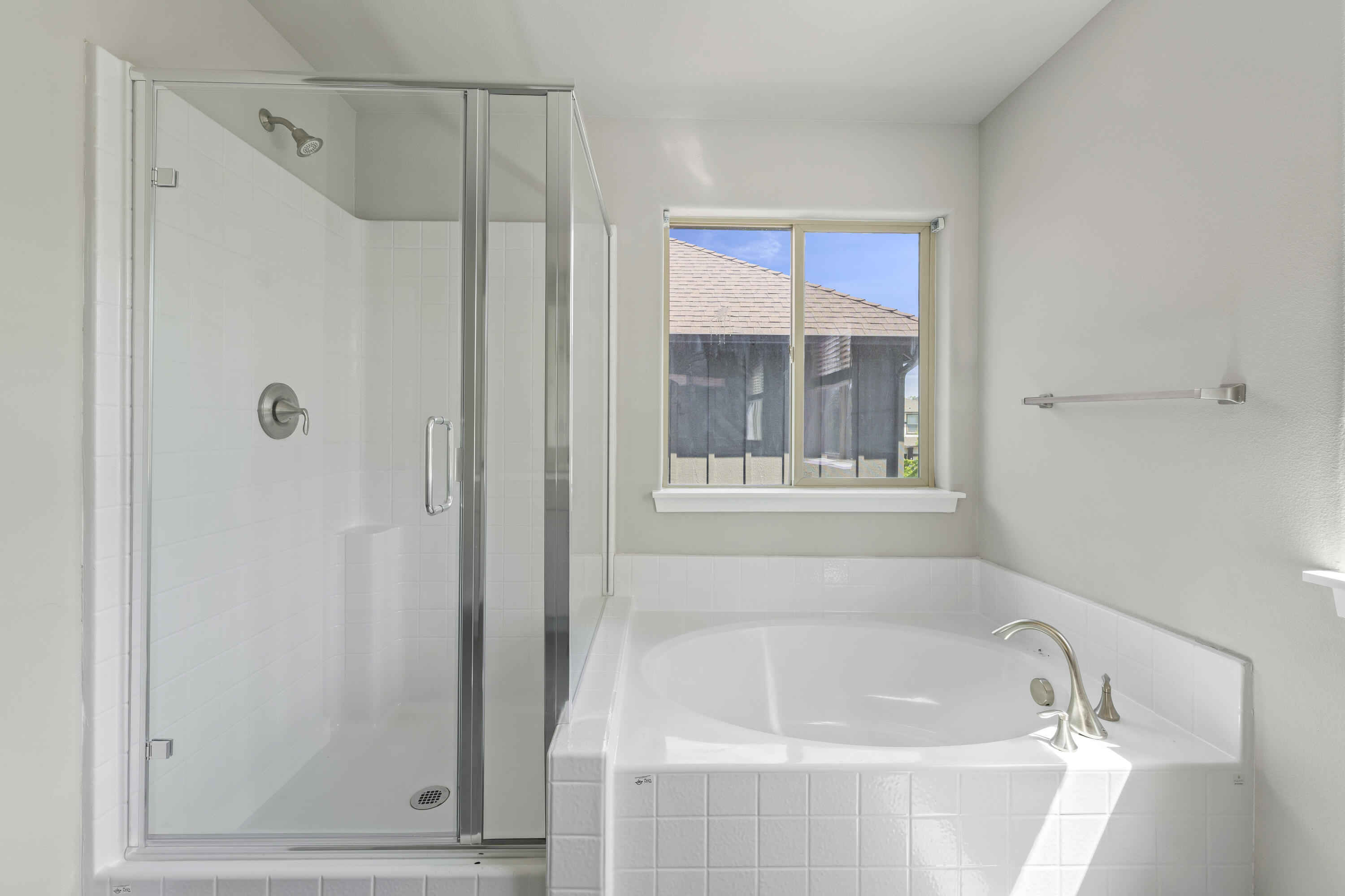 21189 Ritz Place Bend, OR 97702 - Photo 27 of 37 a bathroom with a bathtub and a shower