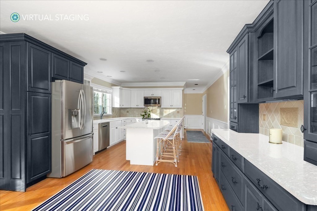 1 Huckleberry Hill Lane Hingham, MA 02043 - Photo 11 of 30 a kitchen with stainless steel appliances granite countertop a refrigerator a stove top oven and a sink