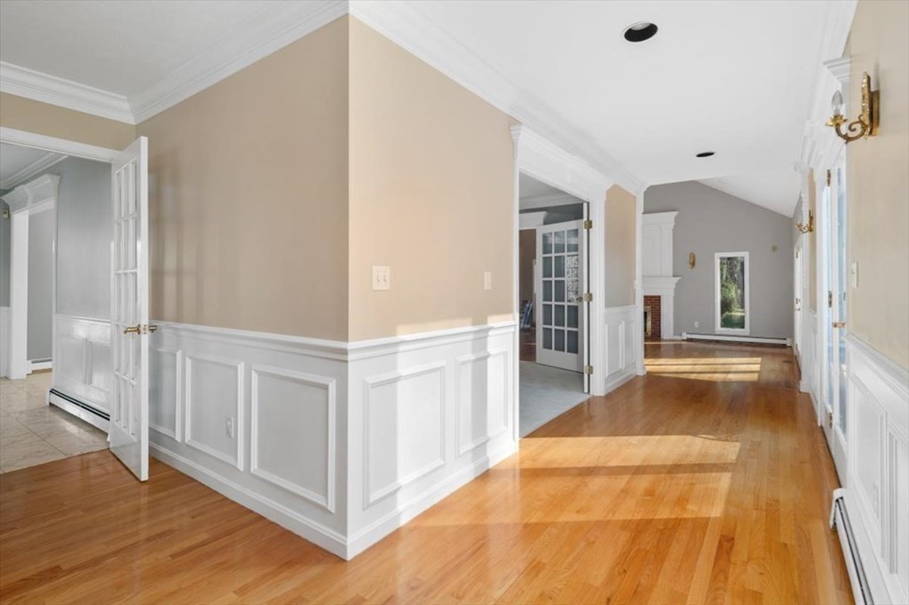 1 Huckleberry Hill Lane Hingham, MA 02043 - Photo 14 of 30 a view of a hallway with wooden floor and cabinet