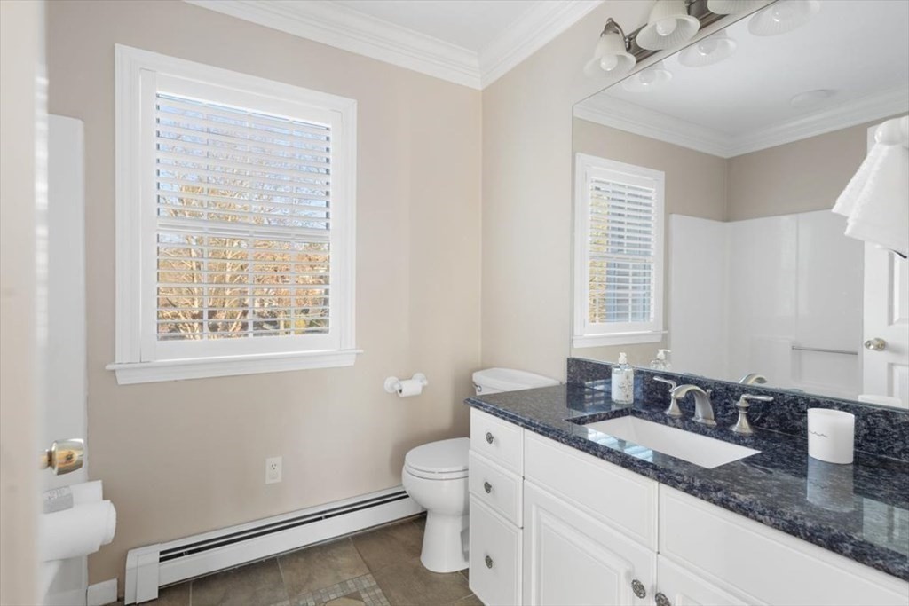 1 Huckleberry Hill Lane Hingham, MA 02043 - Photo 15 of 30 a bathroom with a granite countertop sink toilet and mirror