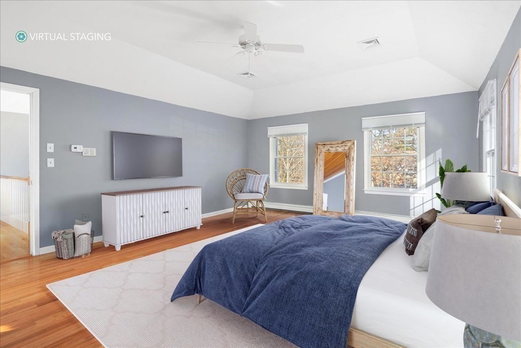 1 Huckleberry Hill Lane Hingham, MA 02043 - Photo 18 of 30 a bedroom with a bed and a flat screen tv