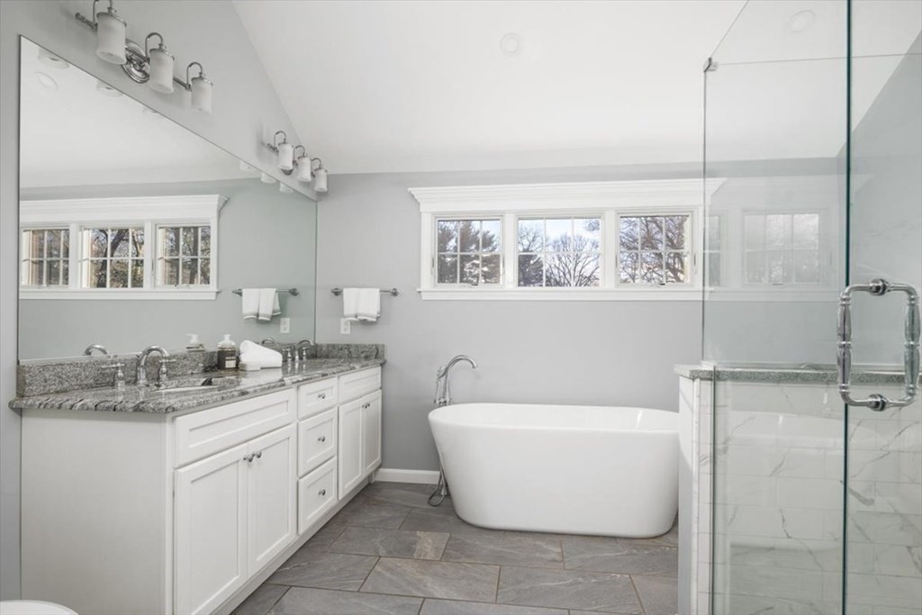 1 Huckleberry Hill Lane Hingham, MA 02043 - Photo 19 of 30 a bathroom with a granite countertop sink mirror and bathtub