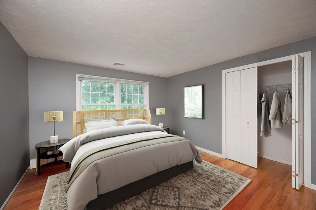 1 Huckleberry Hill Lane Hingham, MA 02043 - Photo 21 of 30 a bedroom with a bed and wooden floor