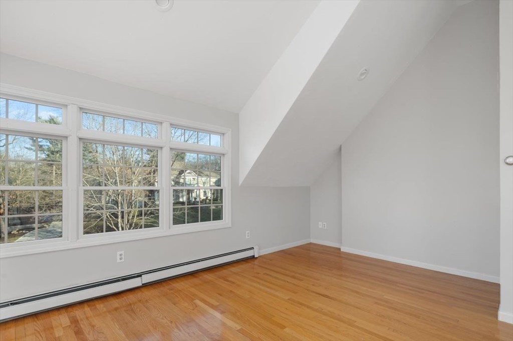 1 Huckleberry Hill Lane Hingham, MA 02043 - Photo 25 of 30 a view of an empty room with wooden floor and a window