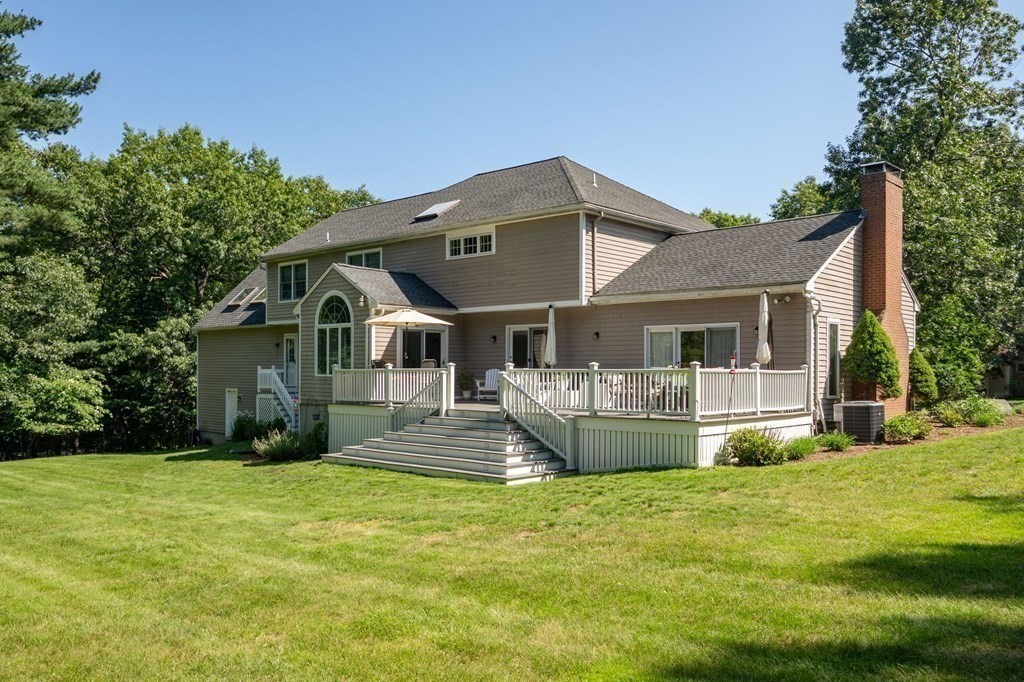 1 Huckleberry Hill Lane Hingham, MA 02043 - Photo 27 of 30 a front view of a house with a yard