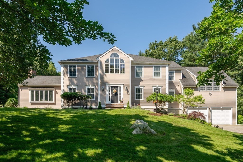 1 Huckleberry Hill Lane Hingham, MA 02043 - Photo 3 of 30 a front view of a house with a yard
