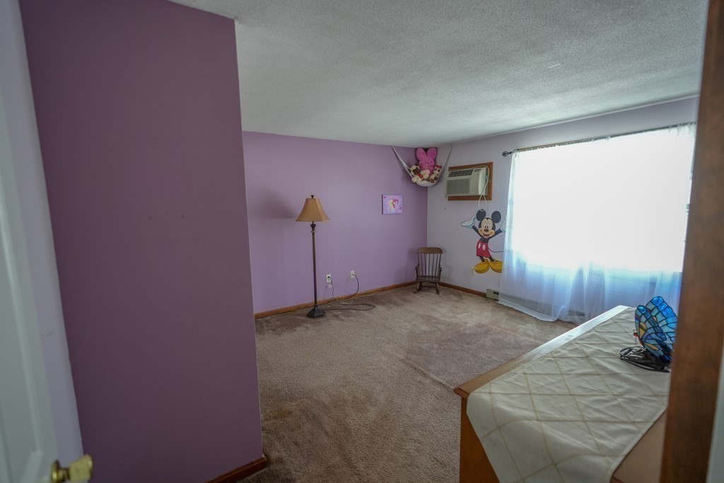 283 Fuller Road, Unit E Chicopee, MA 01020 - Photo 12 of 21 a view of a livingroom with furniture and stairs