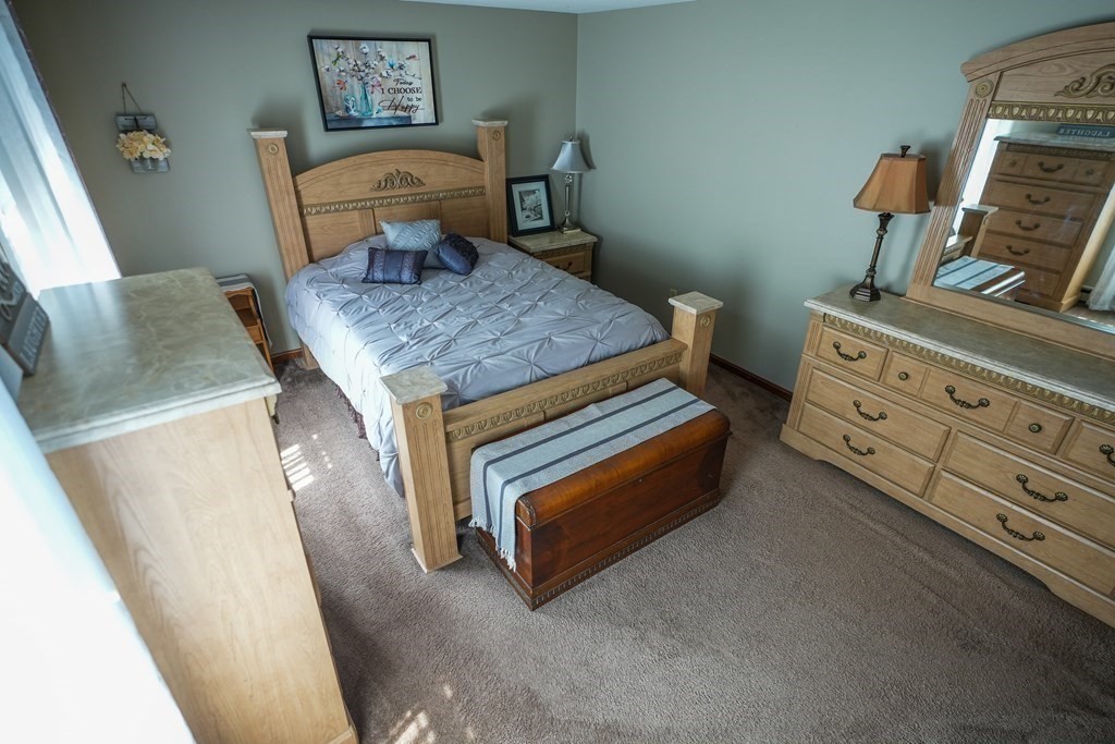 283 Fuller Road, Unit E Chicopee, MA 01020 - Photo 15 of 21 a bedroom with a bed and furniture
