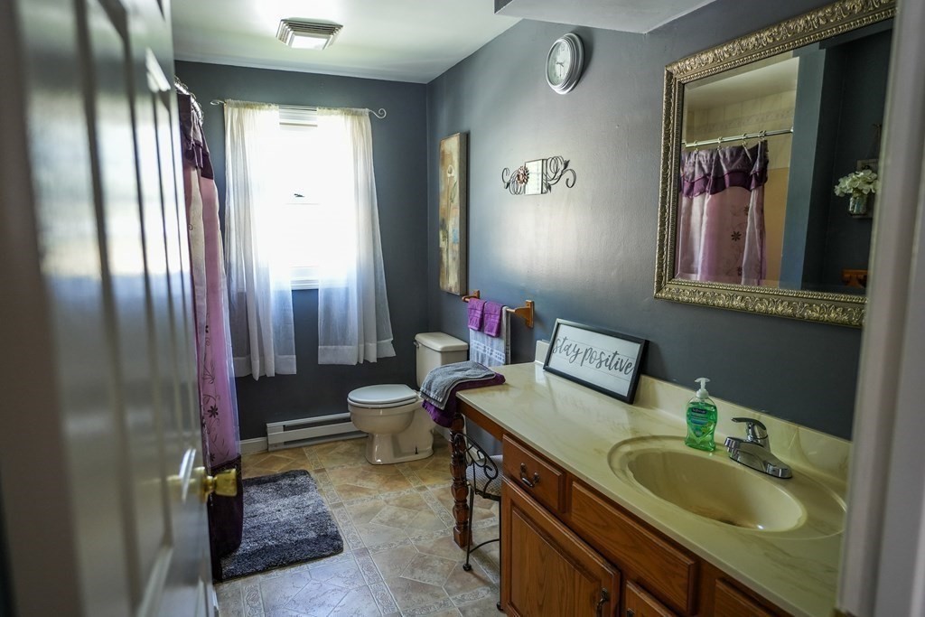 283 Fuller Road, Unit E Chicopee, MA 01020 - Photo 17 of 21 a bathroom with a sink double vanity granite and a mirror