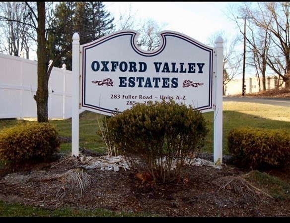 283 Fuller Road, Unit E Chicopee, MA 01020 - Photo 2 of 21 a sign broad on the side of the road