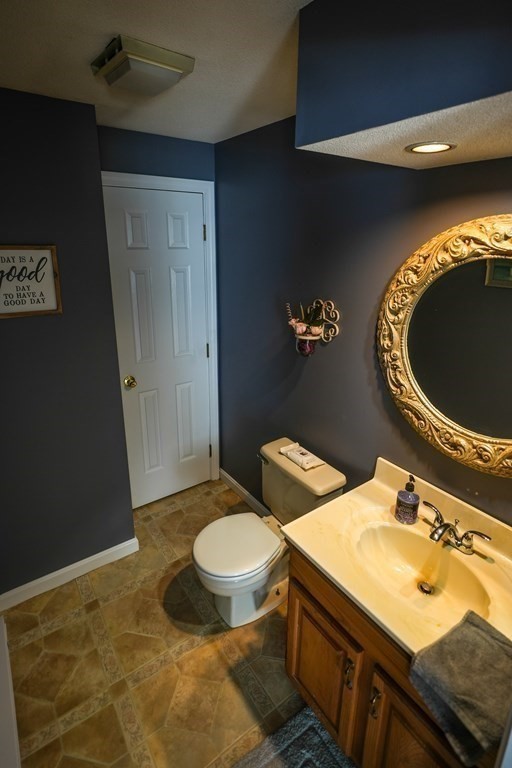 283 Fuller Road, Unit E Chicopee, MA 01020 - Photo 9 of 21 a bathroom with a sink and a mirror