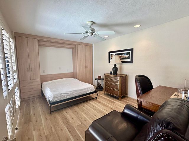 a bathroom with a double vanity sink mirror and toilet