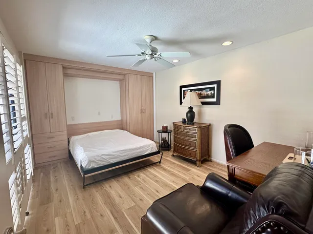 a bathroom with a double vanity sink mirror and toilet