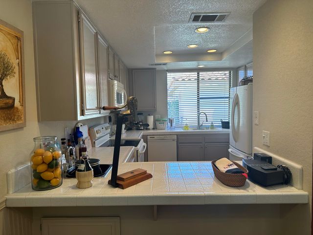 a bed room with a bed and a lamp