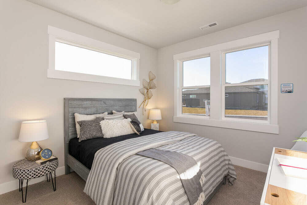 3803 Northeast Oakside Loop Bend, OR 97701 - Photo 16 of 22 a bedroom with a bed and a window
