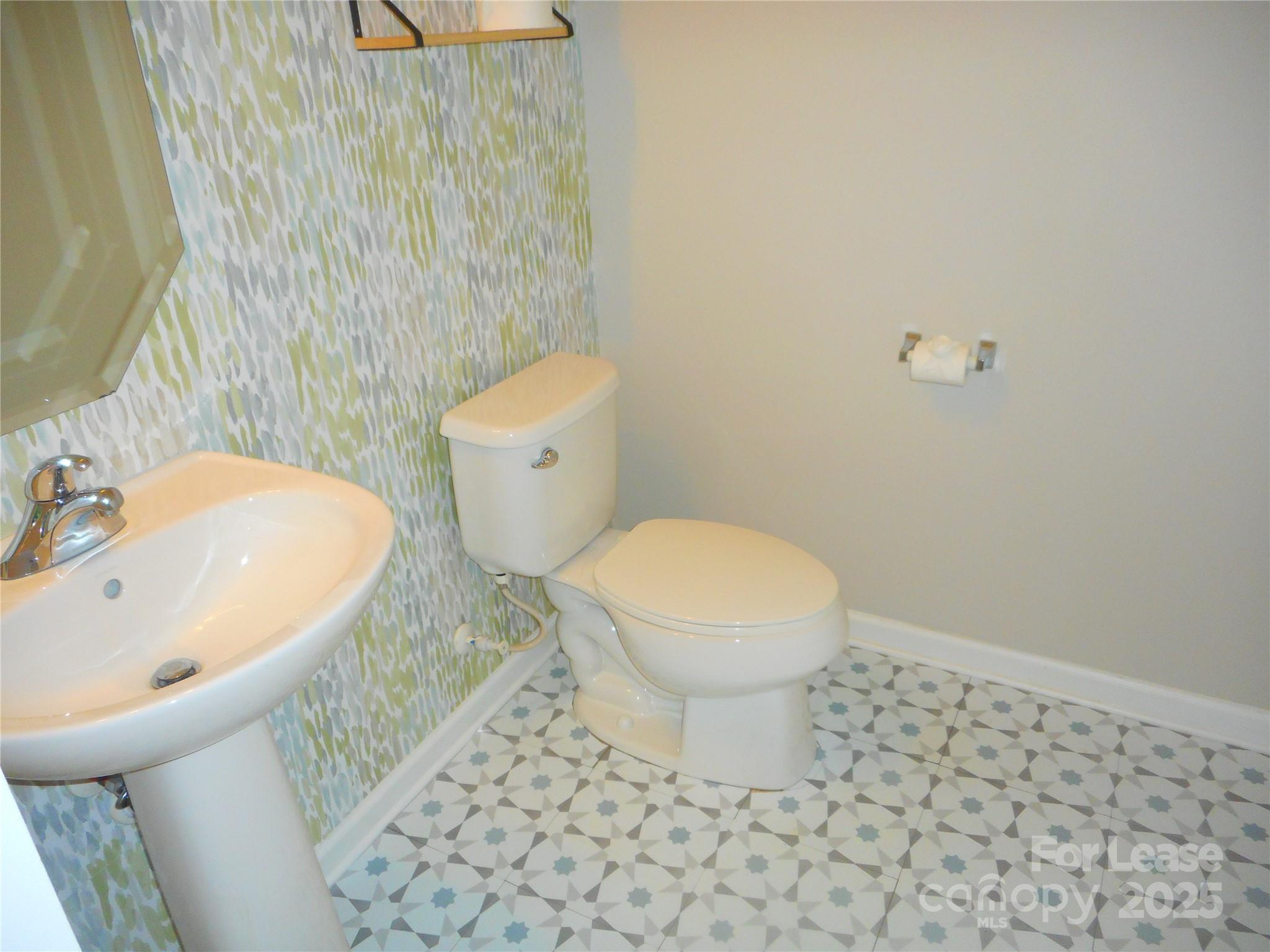 1004 Marcus Street Indian Land, SC 29707 - Photo 11 of 26 a bathroom with a toilet and a sink