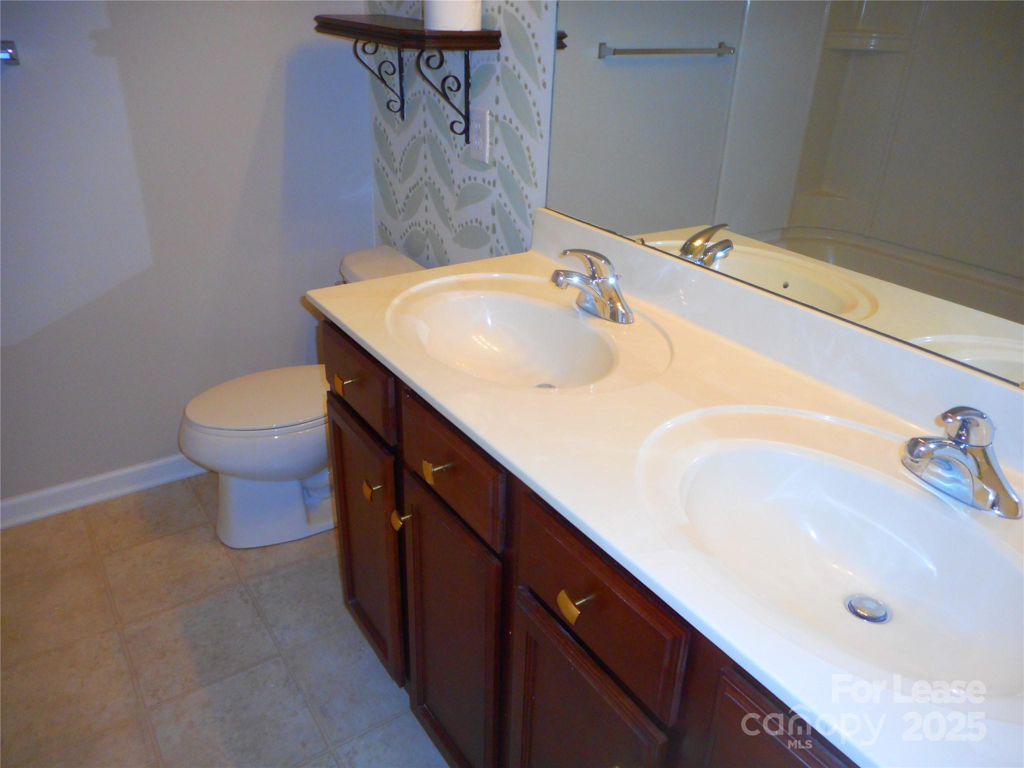 1004 Marcus Street Indian Land, SC 29707 - Photo 16 of 26 a bathroom with a sink and a toilet