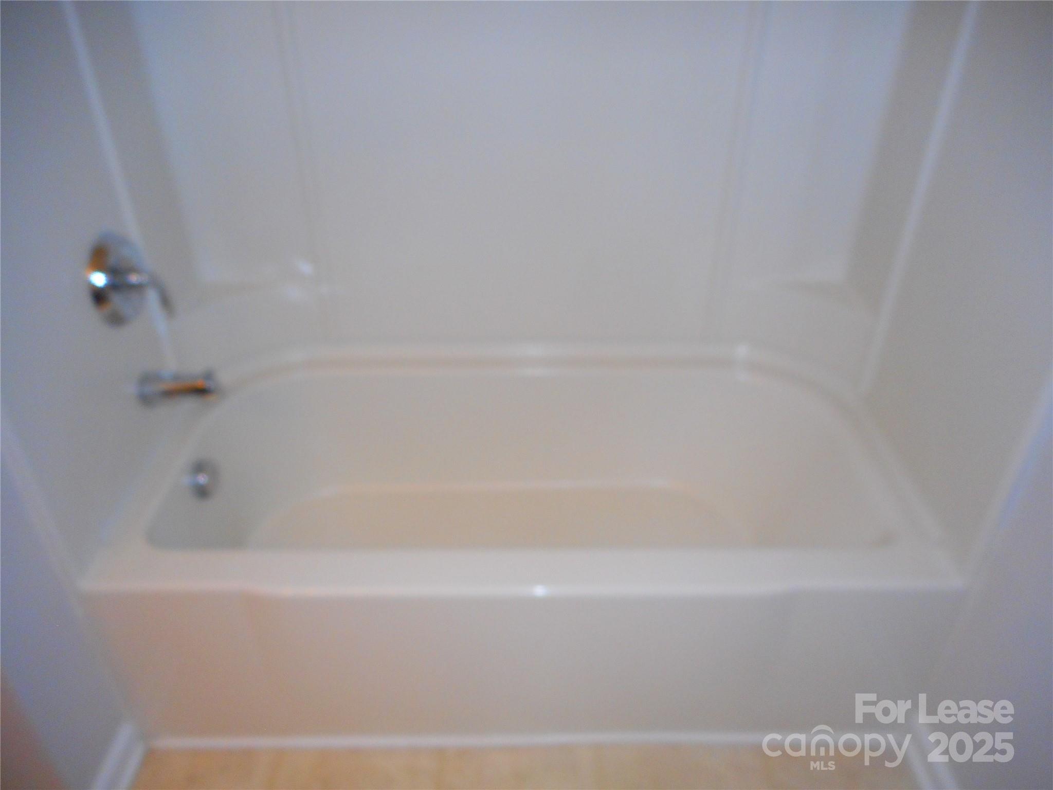 1004 Marcus Street Indian Land, SC 29707 - Photo 17 of 26 a close up of a bathtub