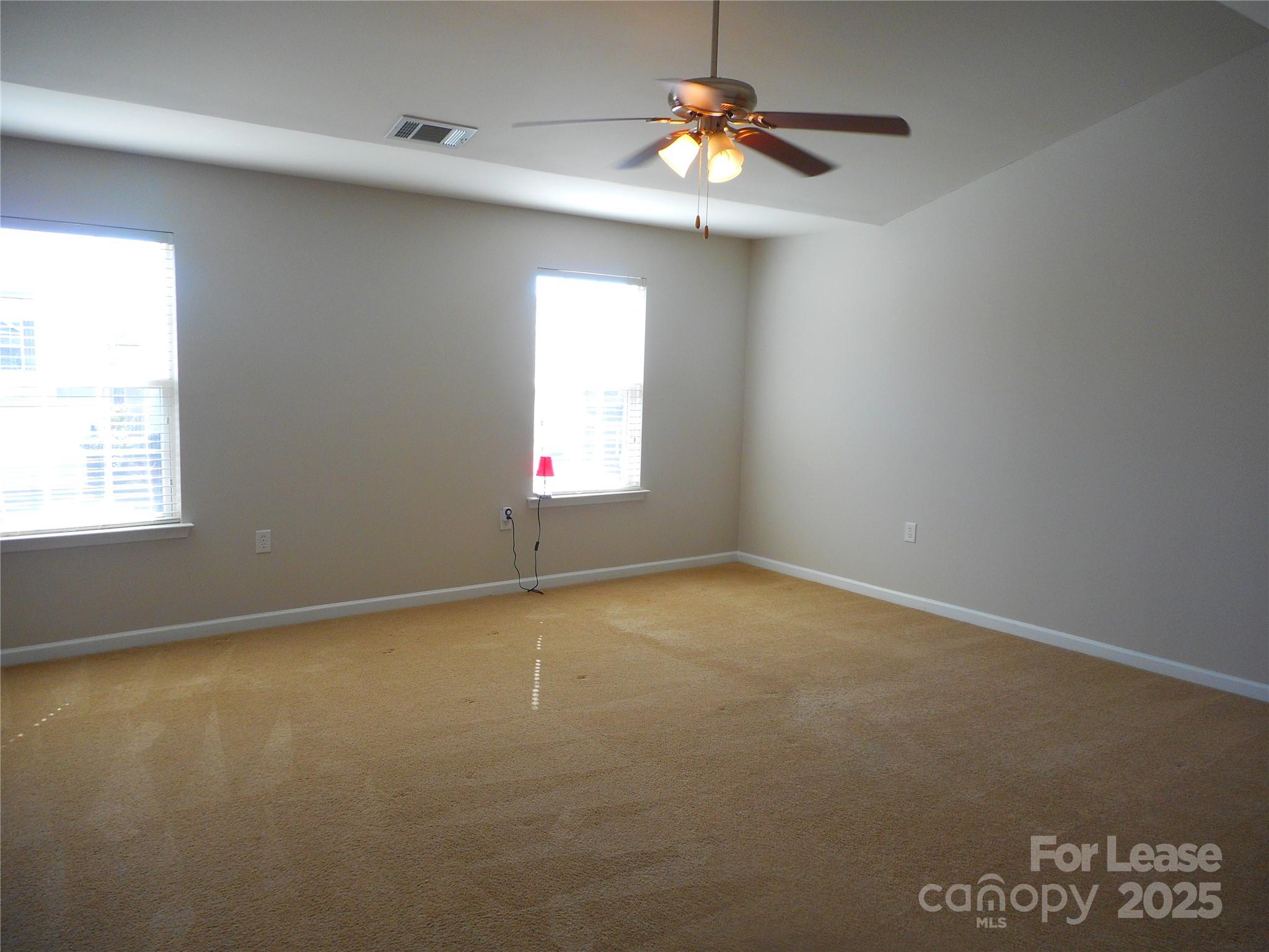 1004 Marcus Street Indian Land, SC 29707 - Photo 22 of 26 an empty room with windows and fan