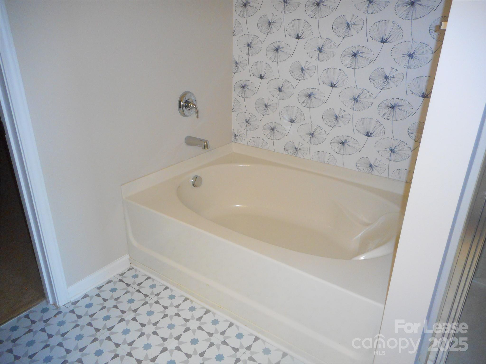 1004 Marcus Street Indian Land, SC 29707 - Photo 24 of 26 a bathroom with a bathtub