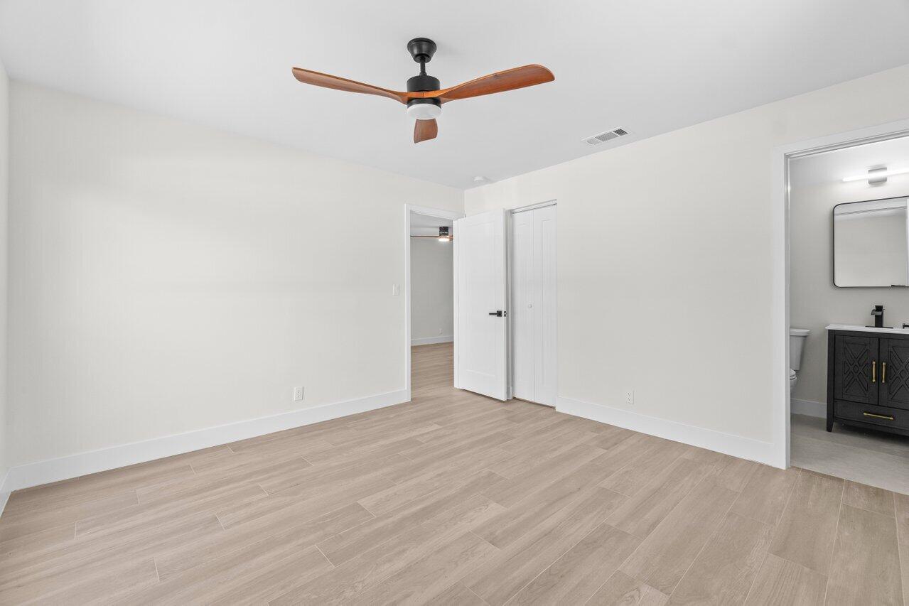 4498 Northwest 2nd Avenue Boca Raton, FL 33431 - Photo 16 of 43 wooden floor in an empty room