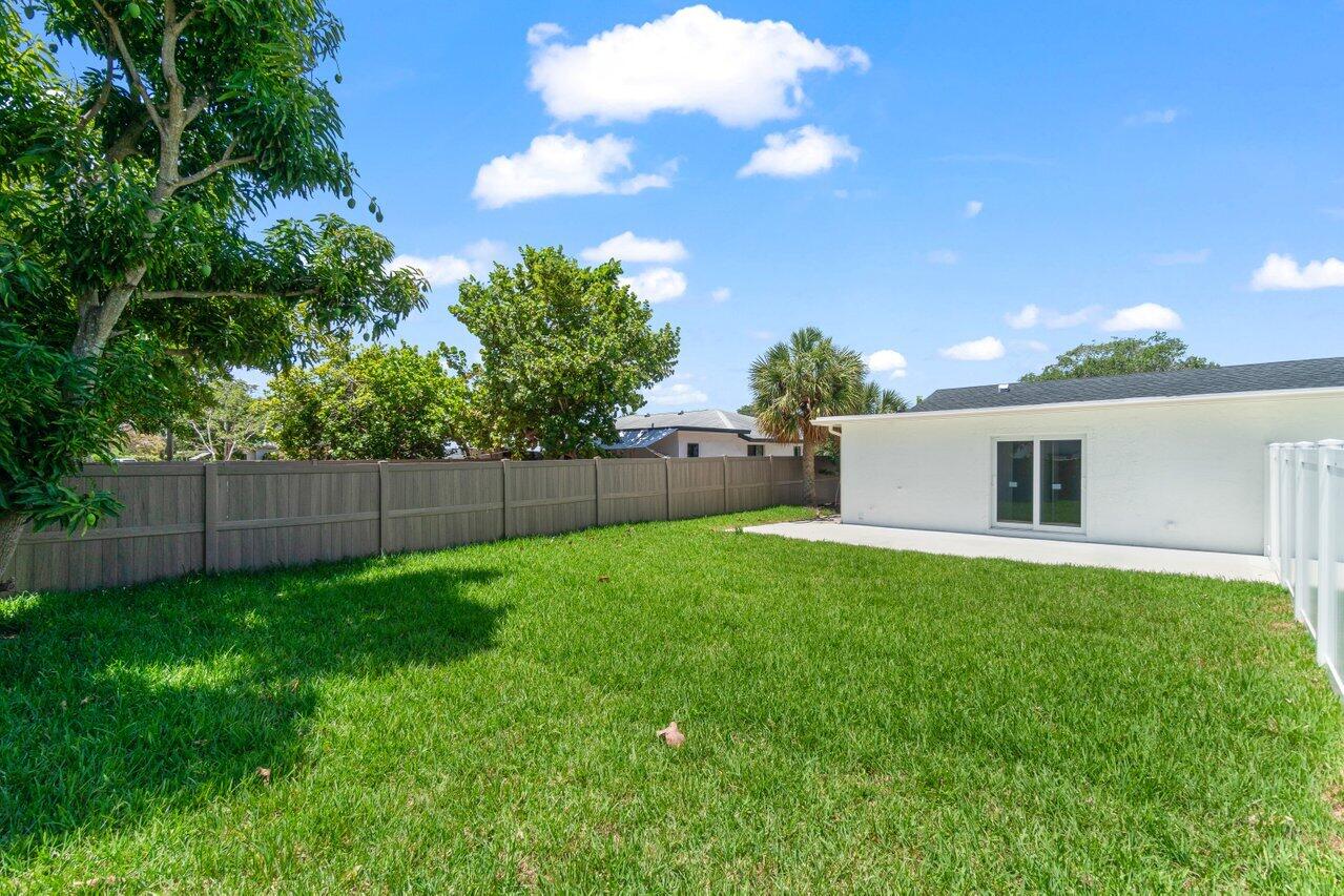 4498 Northwest 2nd Avenue Boca Raton, FL 33431 - Photo 20 of 43 a backyard of a house with lots of green space