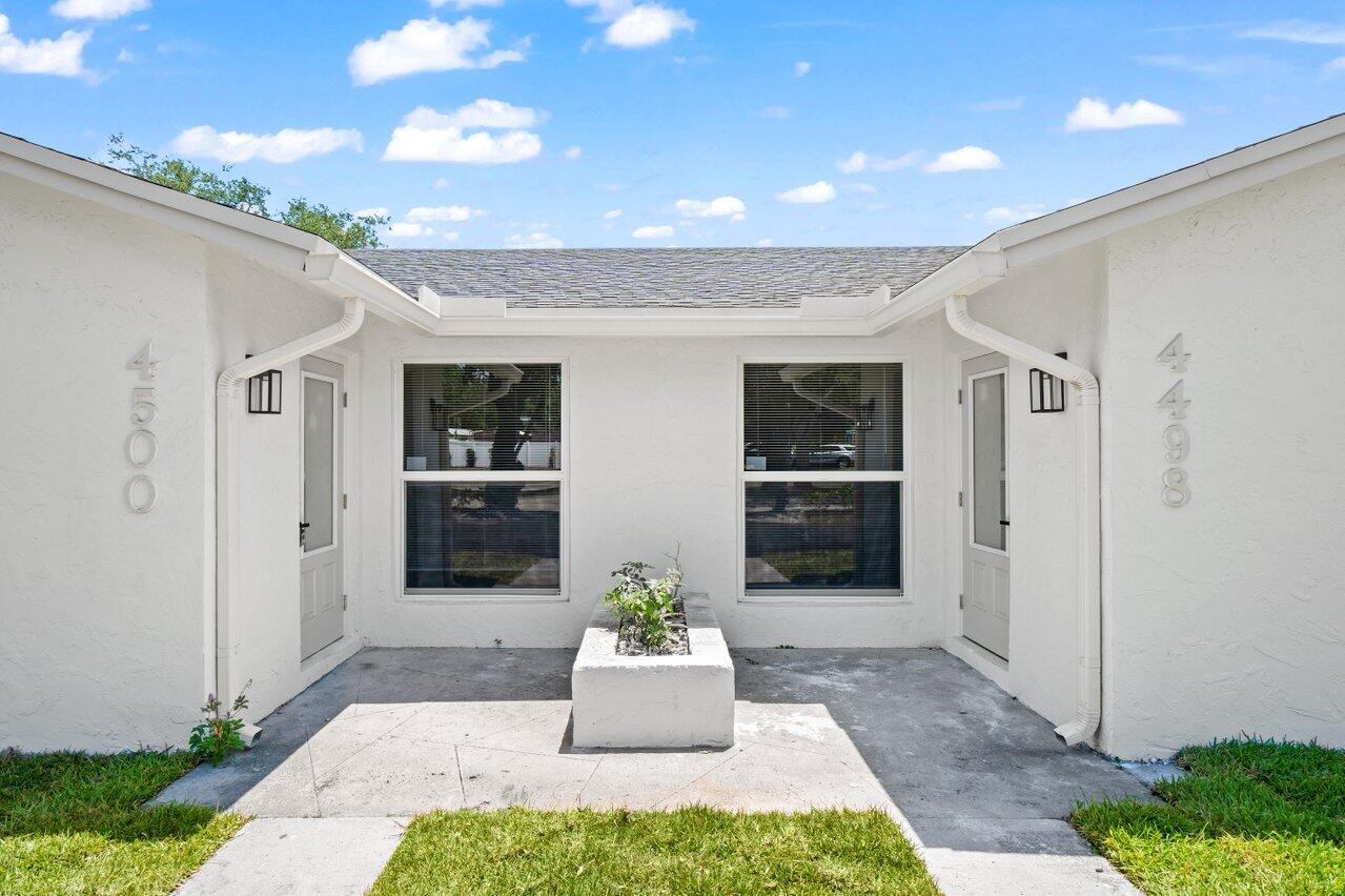 4498 Northwest 2nd Avenue Boca Raton, FL 33431 - Photo 41 of 43 a front view of a house with entryway