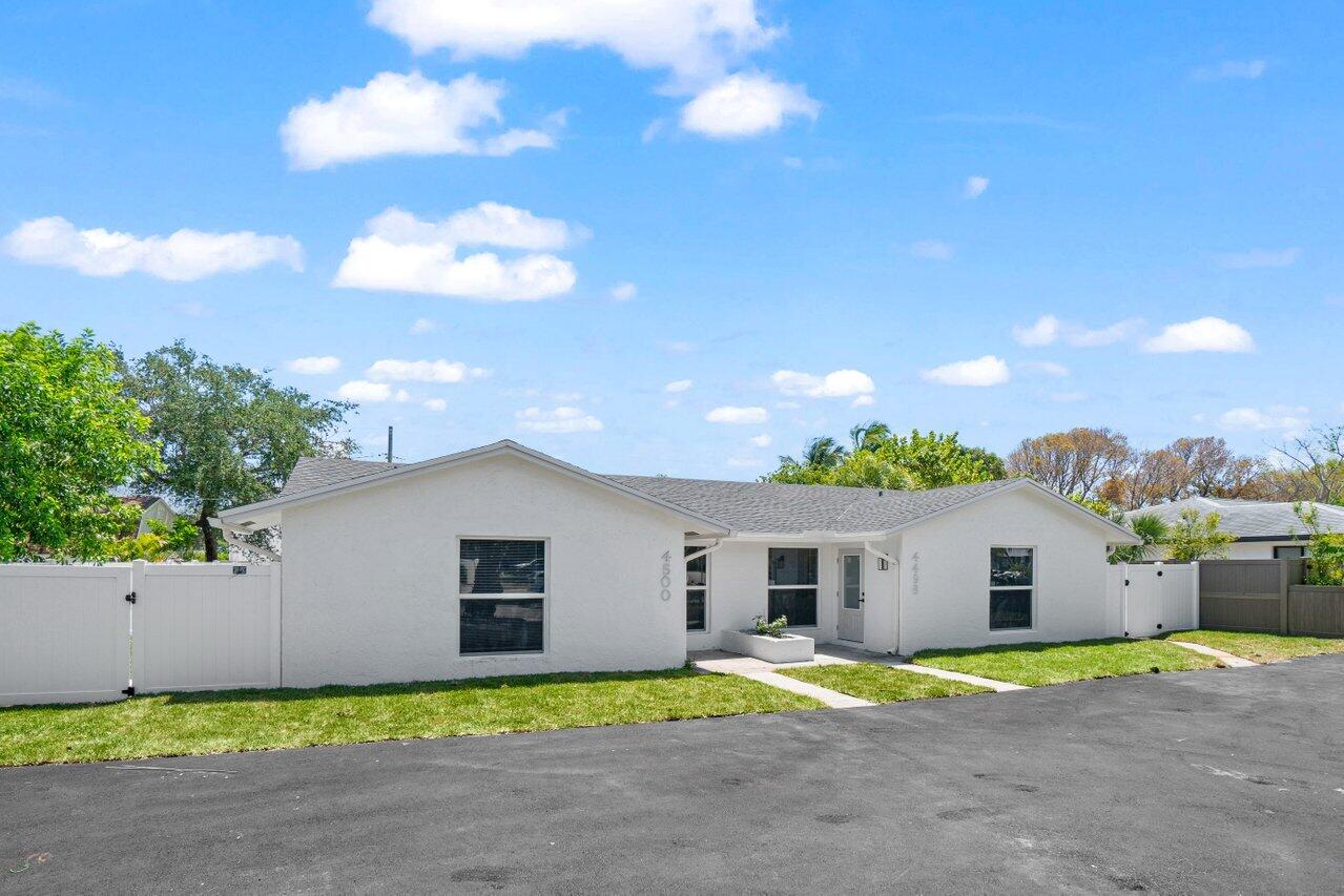 4498 Northwest 2nd Avenue Boca Raton, FL 33431 - Photo 43 of 43 a view of a house with a yard and large tree