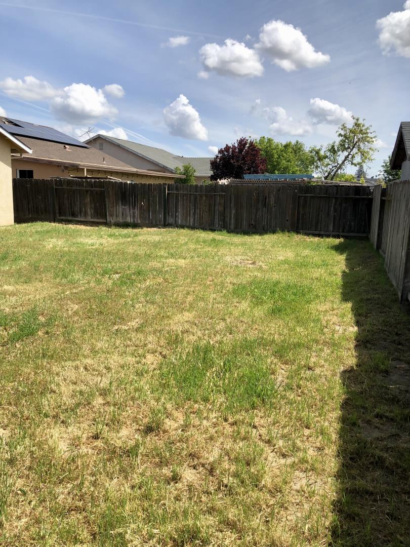 6565 Nicholas Drive Winton, CA 95388 - Photo 14 of 17 a view of a lake with a yard