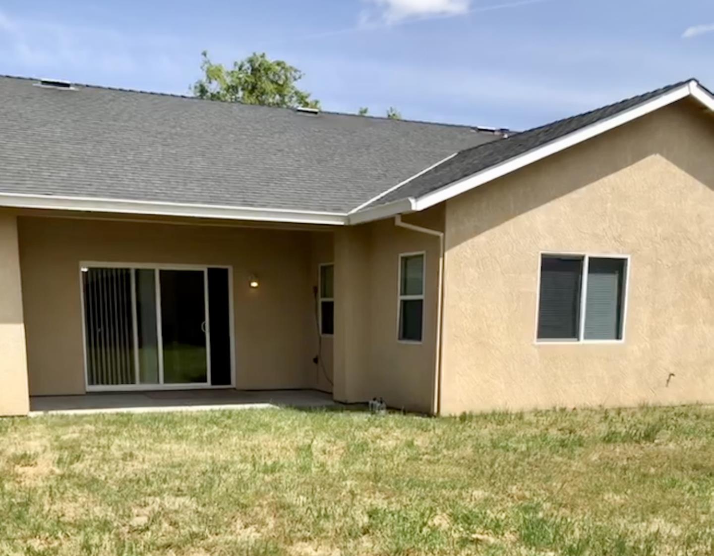6565 Nicholas Drive Winton, CA 95388 - Photo 15 of 17 front view of a house with a yard
