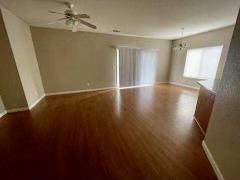 6565 Nicholas Drive Winton, CA 95388 - Photo 3 of 17 an empty room with wooden floor and windows