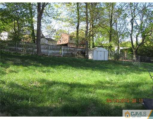 37 Wilcox Road New Brunswick, NJ 08901 - Photo 3 of 8 a view of a backyard with a trees