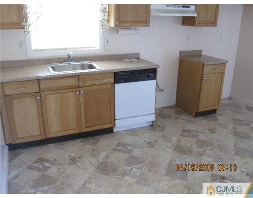 37 Wilcox Road New Brunswick, NJ 08901 - Photo 5 of 8 a room with a sink cabinets and utility room