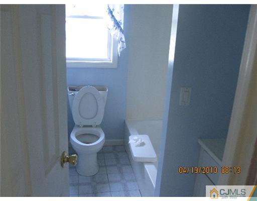 37 Wilcox Road New Brunswick, NJ 08901 - Photo 6 of 8 a bathroom with a toilet and a sink