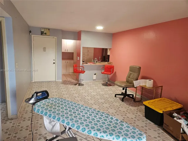 a bedroom with furniture and window