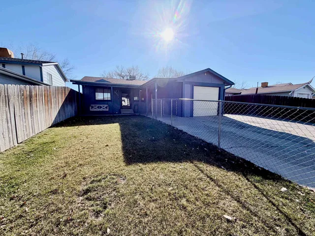 a view of a backyard with a house
