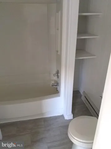 a bathroom with a toilet and a sink