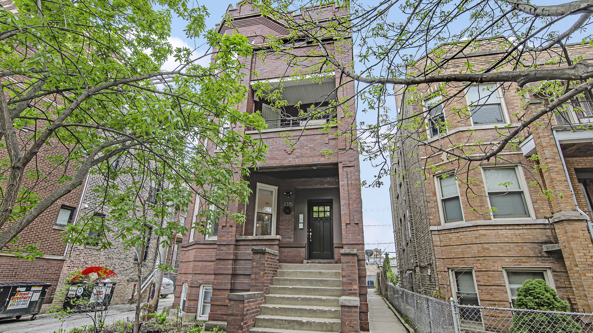 2315 West Rice Street, Unit 1N Chicago, IL 60622 - Photo 1 of 37 a view of a building with a tree front of house