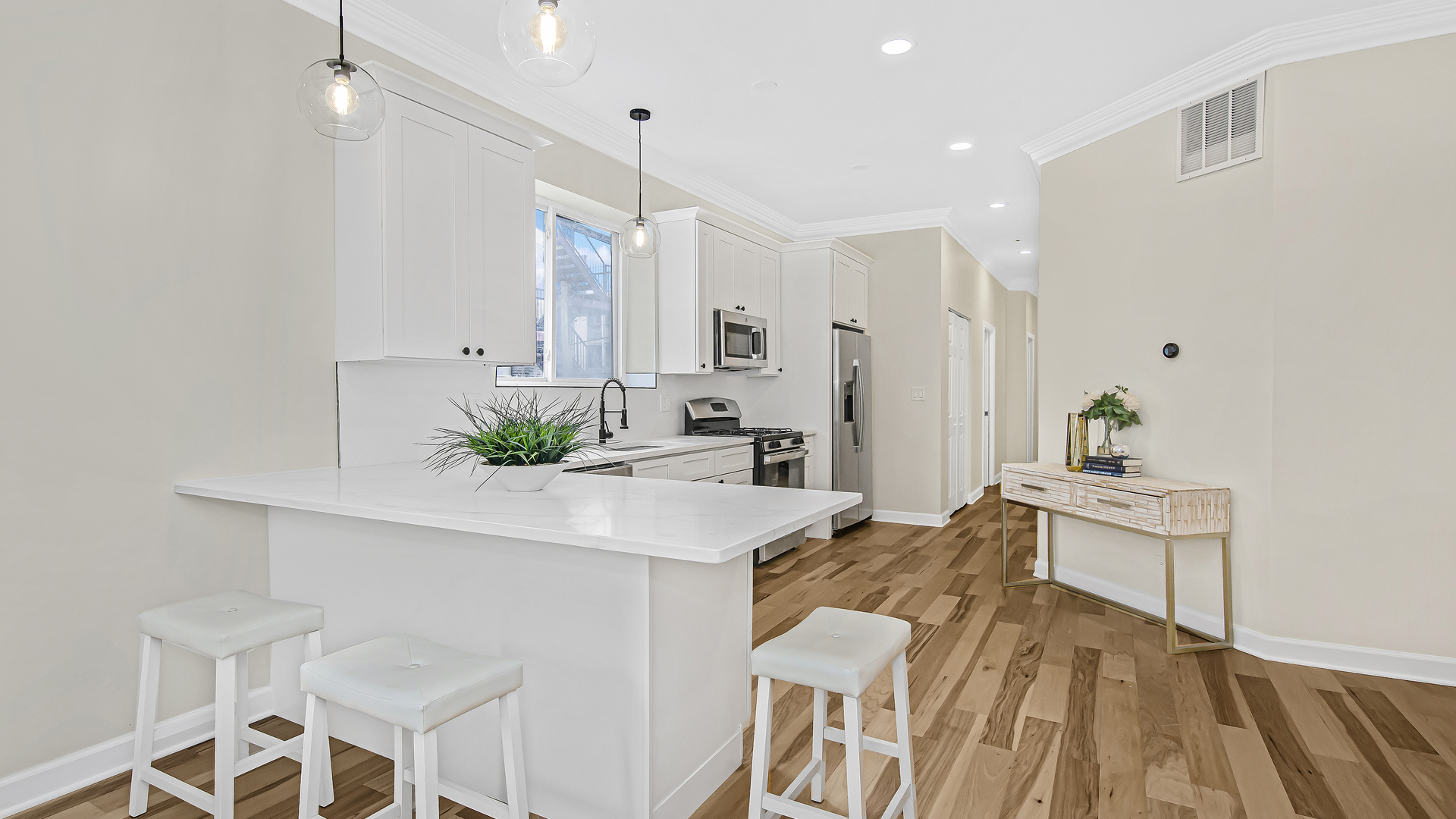 2315 West Rice Street, Unit 1N Chicago, IL 60622 - Photo 11 of 37 a view of a kitchen area with furniture and wooden floor