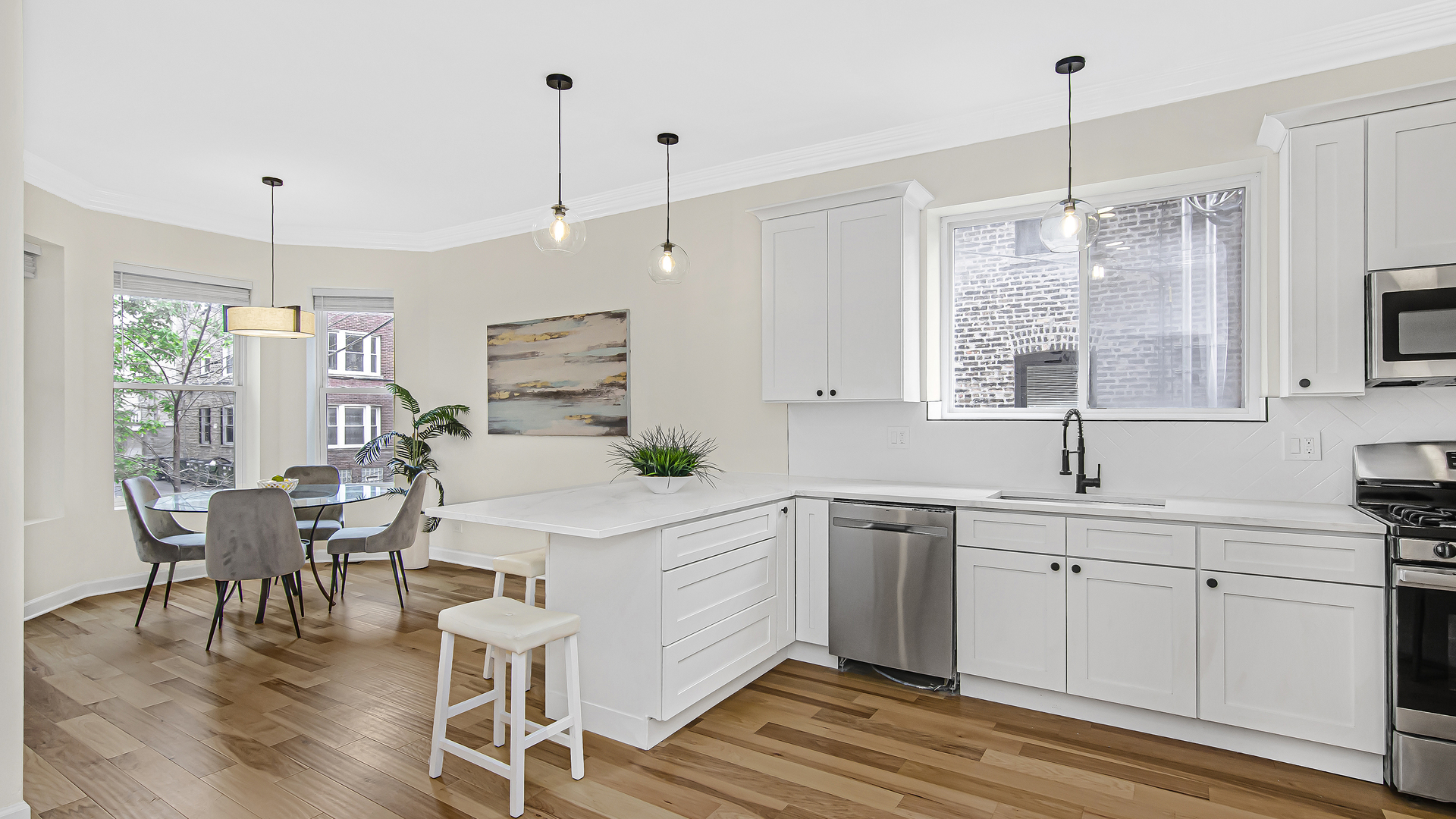 2315 West Rice Street, Unit 1N Chicago, IL 60622 - Photo 12 of 37 a kitchen with white cabinets and white appliances
