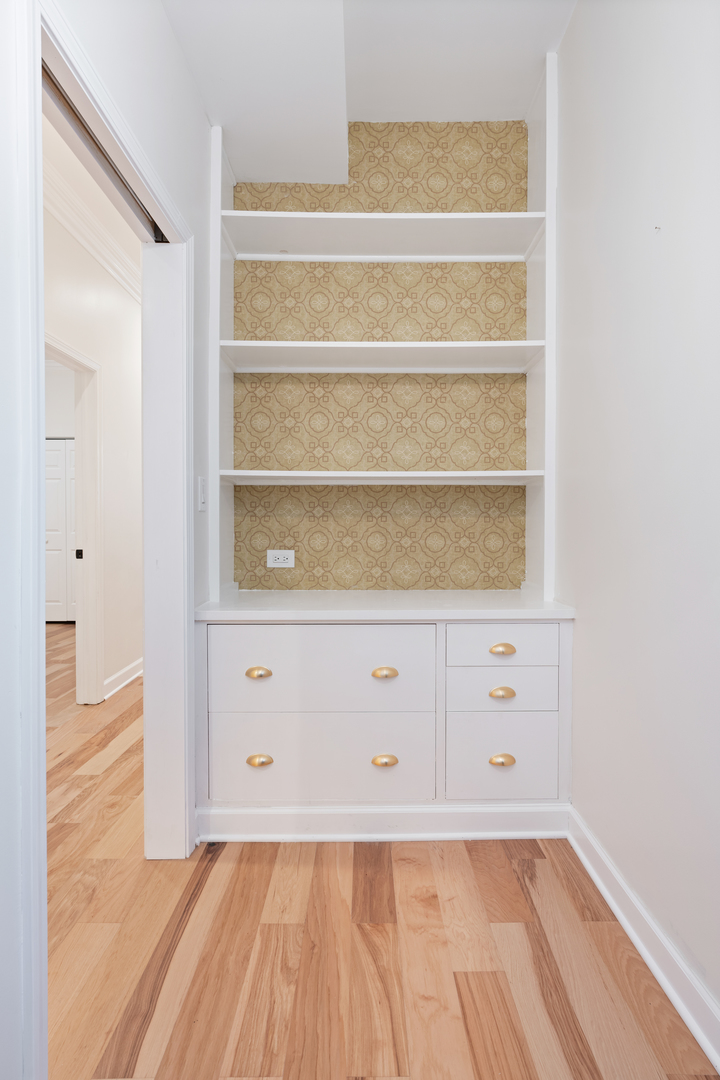 2315 West Rice Street, Unit 1N Chicago, IL 60622 - Photo 17 of 37 a view of an empty room with wooden floor