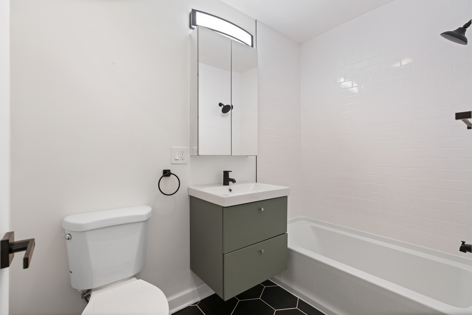 2315 West Rice Street, Unit 1N Chicago, IL 60622 - Photo 18 of 37 a bathroom with a sink toilet and shower